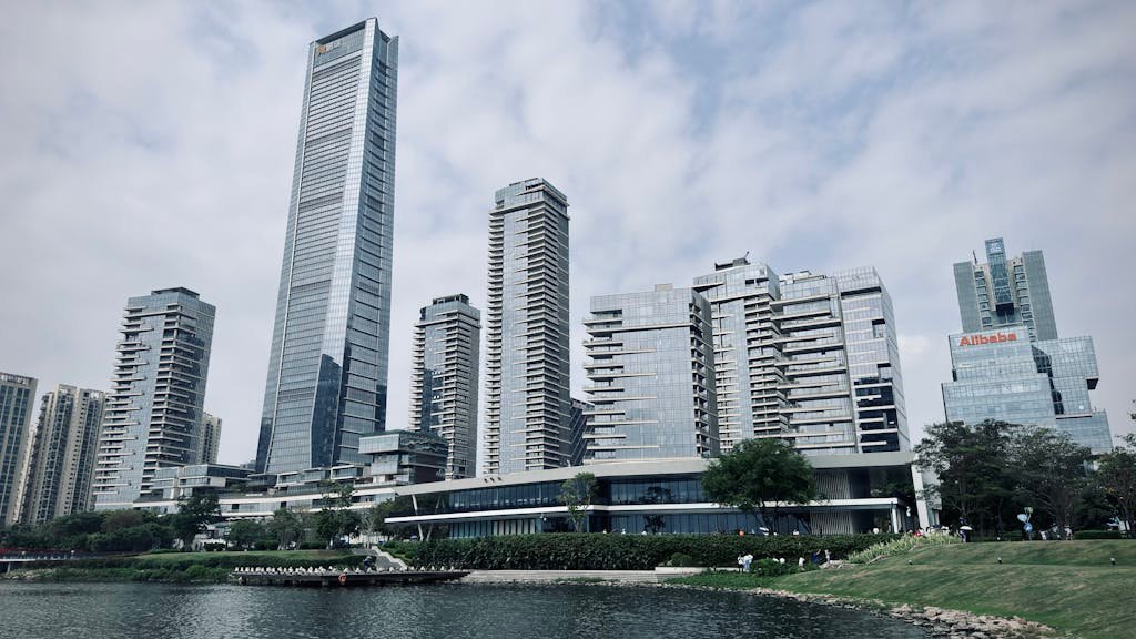 Modern skyscrapers of Shenzhen skyline by the waterfront on a cloudy day.